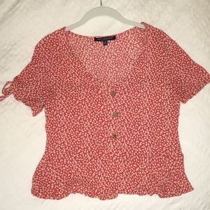 Red and white patterned blouse